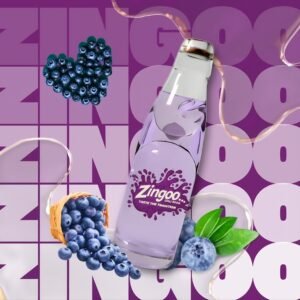 A refreshing glass bottle of Zingoo Blueberry Goli Soda with the classic marble seal, showcasing vibrant purple color and nostalgic fizz.